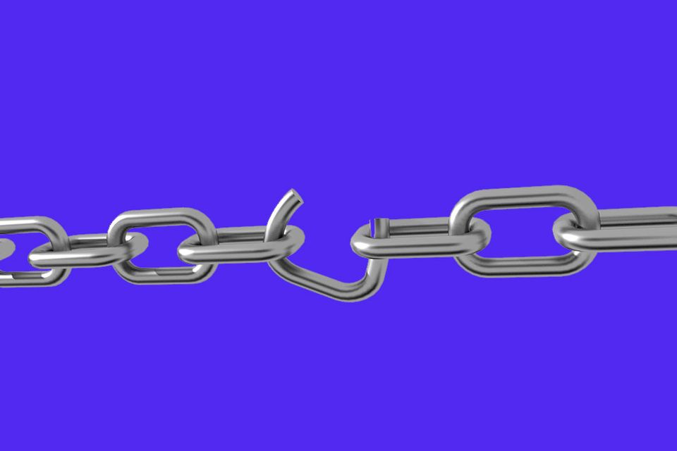 Metal chain with a broken link on a purple back
